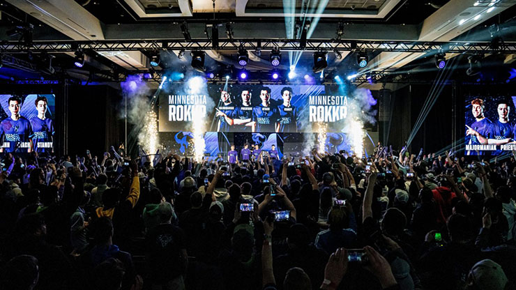 Image of the Minnesota Rokkr after winning a Call of Duty match in front of a crowd celebrating their victory.